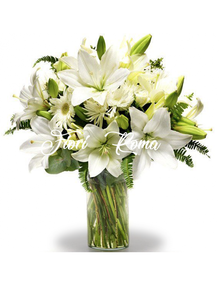 Bouquet with white lilies, white gerberas and white complementary flowers.
