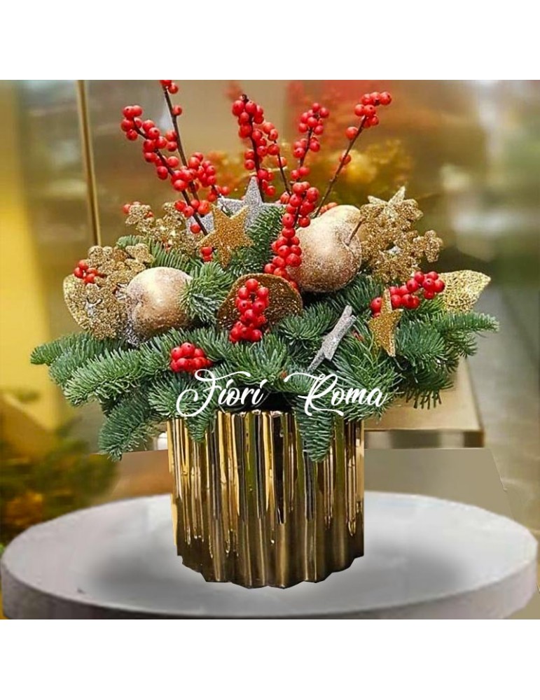 Elegant Christmas centerpiece with fir berries, candles, Christmas decorations and ceramic vase
